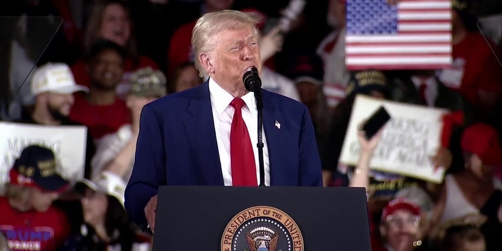 Trump laughs off protester who attempted to disrupt 100 days speech: ‘Thought it was a guy’