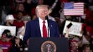 Trump laughs off protester who attempted to disrupt 100 days speech: ‘Thought it was a guy’