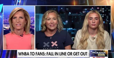 Mom, daughter told to cover XX/XY shirts at WNBA game