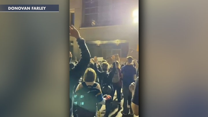 Oregon protesters gather outside Portland mayor's apartment