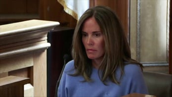 Jennifer McCabe listens to 911 call during testimony in Karen Read's trial