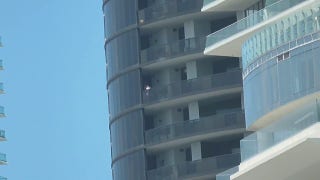 Dolphins star Tyreek Hill, wife look over balcony amid domestic dispute