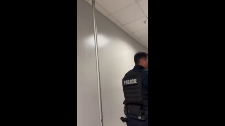 Terrifying moments as police evacuate school building