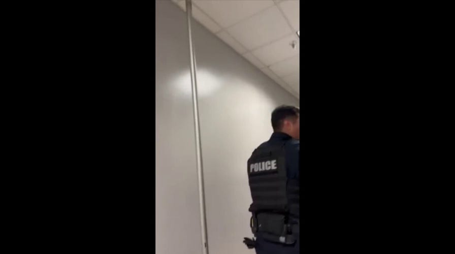 Terrifying moments as police evacuate school building