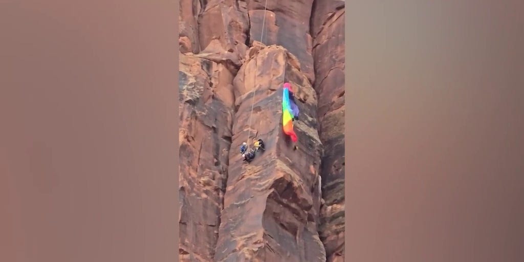 Heart-stopping video shows moment BASE jumper is rescued on Utah canyon face