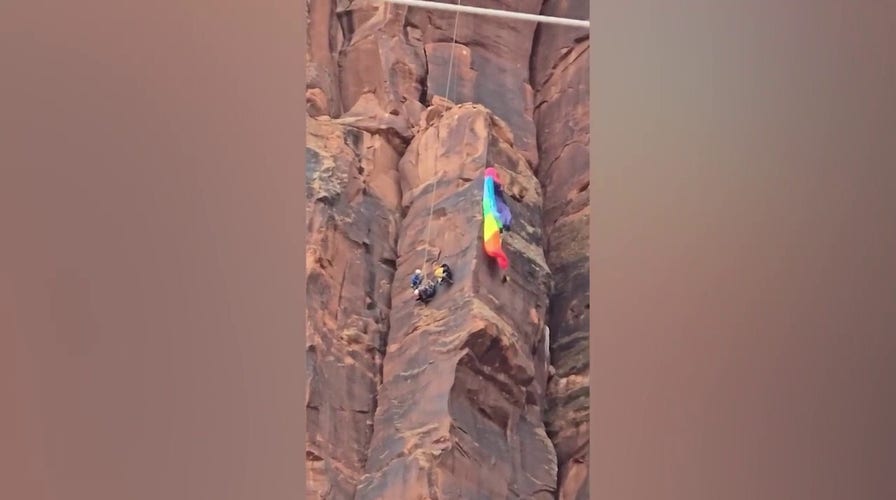 Heart-stopping video shows infinitesimal   BASE jumper is rescued connected  Utah canyon face