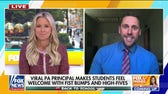 Principal spreads joy in school with fist-bumps and high-fives