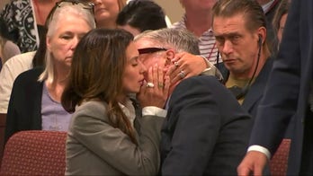 Alec and Hilaria Baldwin whisper to each other on day three of the actor's involuntary manslaughter trial