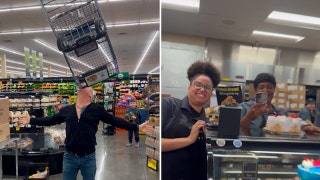 Las Vegas grocery store employees watch circus veteran balance cart on chin
