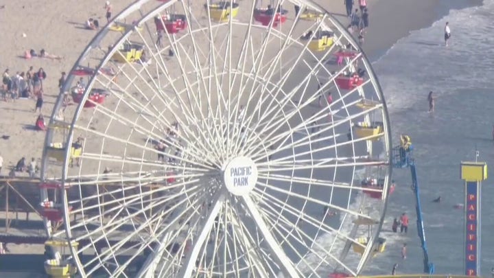 Man climbs California Ferris wheel claiming to have bomb, forcing evacuation of Santa Monica Pier