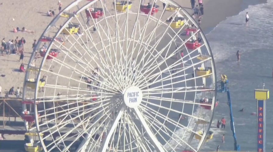 Man climbs California Ferris wheel claiming to have bomb, forcing evacuation of Santa Monica Pier