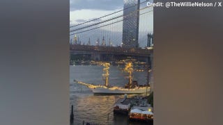 Massive sailing vessel guided by tugboat crashes into Brooklyn Bridge