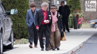 Mourners say goodbye to slain Ohio couple