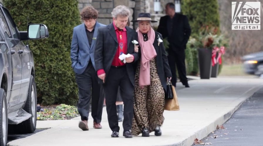 Mourners say goodbye to slain Ohio couple