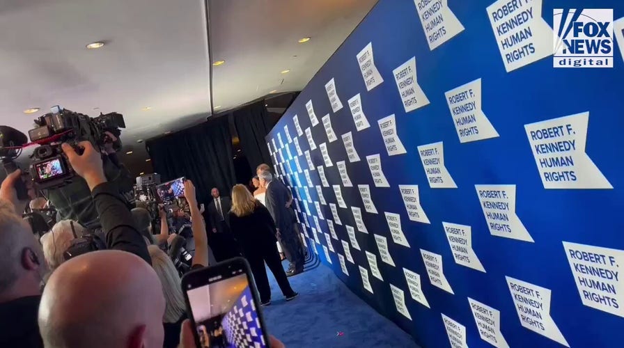 Prince Harry and Meghan Markle pose for the cameras at the Ripple of Hope Awards