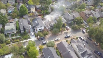 Seattle police investigating after two people found dead inside home, officers injured