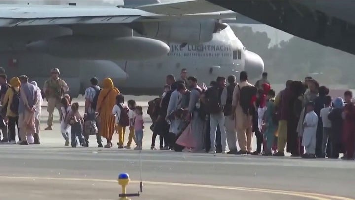 Thousands of Afghans still await safe passage to US