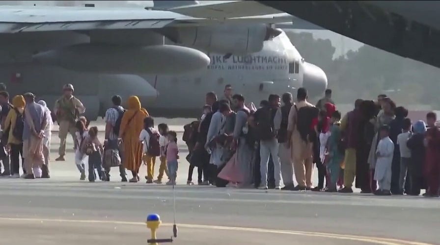 Thousands of Afghans still await safe passage to US
