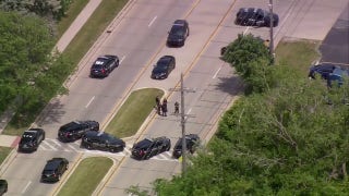 Police search for suspect after reported shooting in Lansing