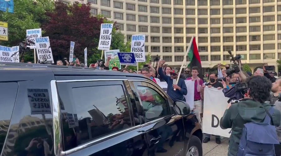 Climate protesters shout 'no more drilling' in blockade outside White House Correspondents' Dinner