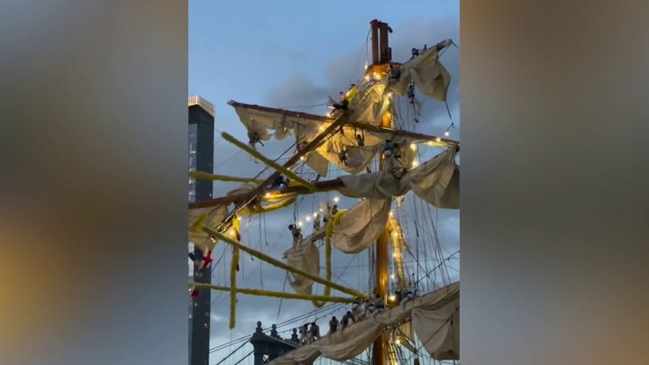 Mexican navy tall ship Cuauhtémoc crew dangle from rigging after striking NYC bridge