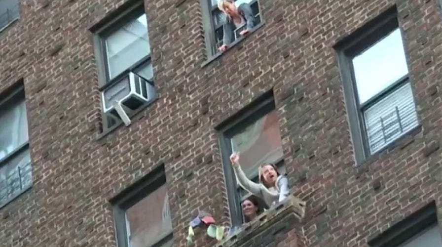 New Yorkers clap each night for health care workers and first responders