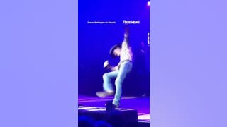 Tim McGraw takes a TUMBLE off platform during concert