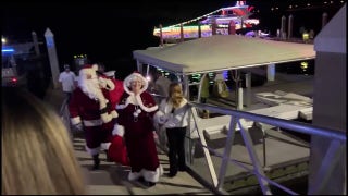 Officers with the Volusia Sheriff’s department in Florida give Santa and Mrs. Claus a boat ride to Toys for Tots event - Fox News