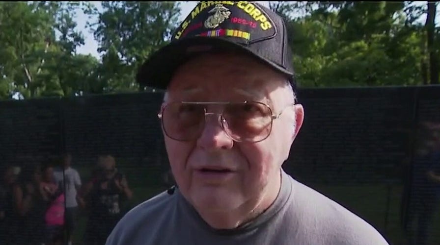 Marine veteran diagnosed with dementia visits Vietnam memorial with family
