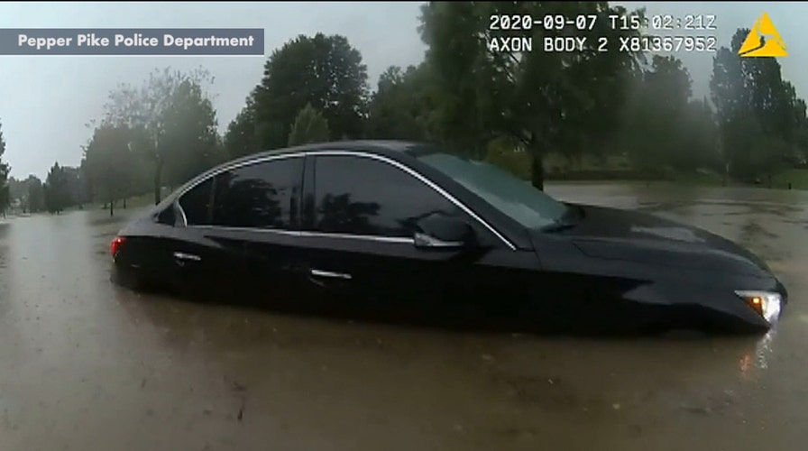 Police officer in Ohio rescues motorist trapped in floodwater