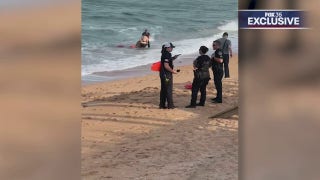 Florida police officer credited with helping rescue two struggling swimmers - Fox News