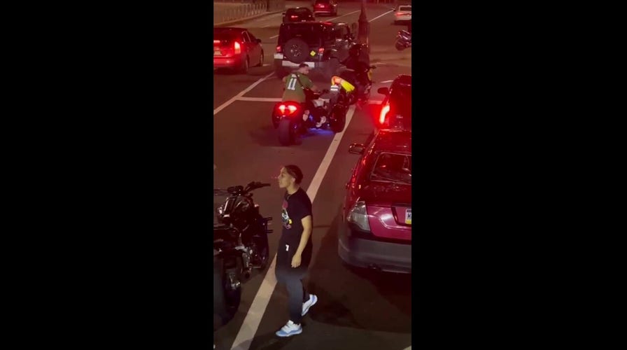 Biker suspect kicked the back of a car windshield