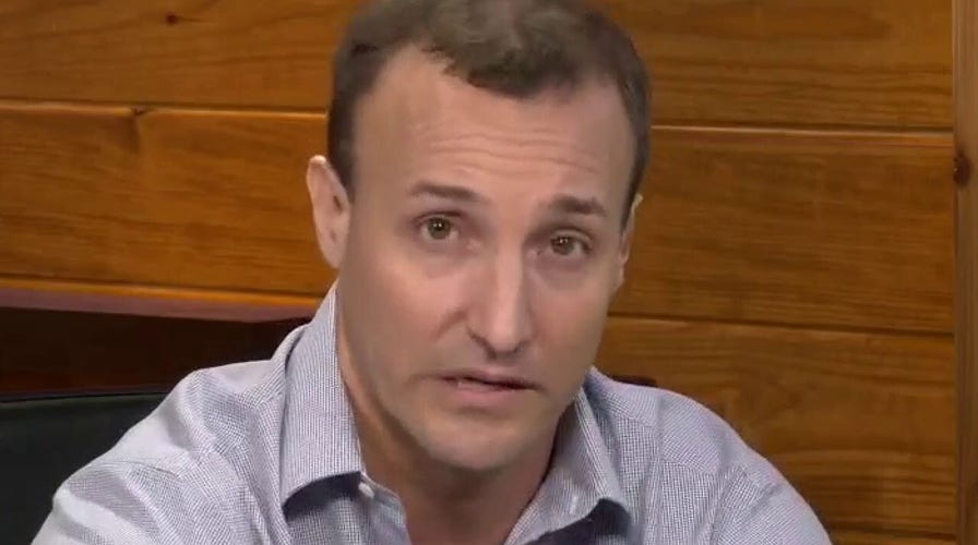 Tucker Carlson sits with former Marine Lt. Col. Stuart Scheller