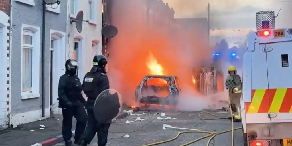 Cars burn in Belfast after Sudanese immigrant charged in stabbing that left man seriously injured