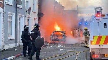 Cars burn in Belfast after Sudanese immigrant charged in stabbing that left man seriously injured