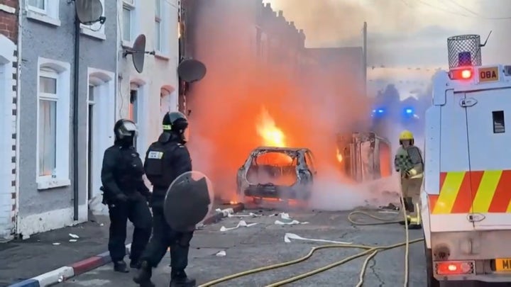 Cars burn in Belfast after Sudanese immigrant charged in stabbing that left man seriously injured