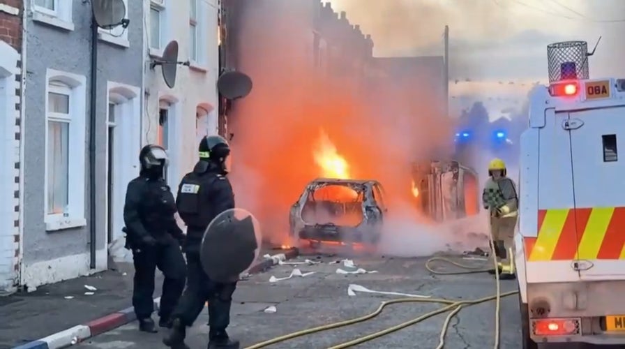 Cars burn in Belfast after Sudanese immigrant charged in stabbing that left man seriously injured
