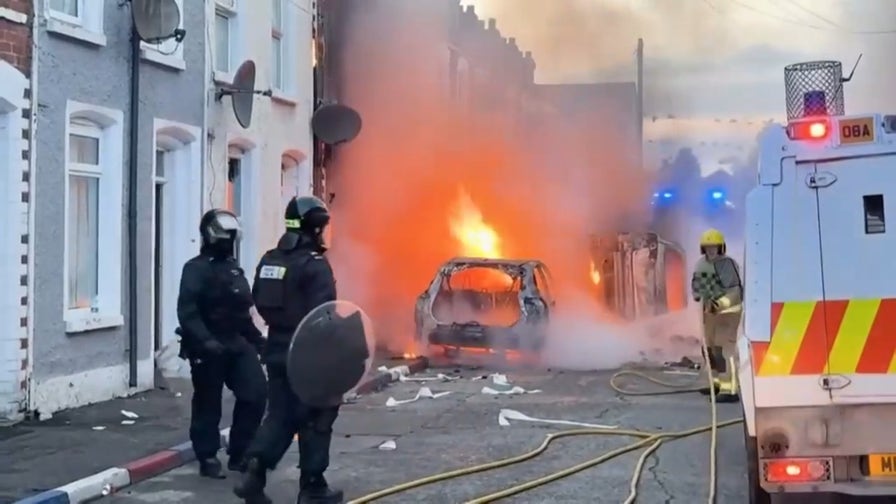 Cars burn in Belfast after Sudanese immigrant charged in stabbing that left man seriously injured