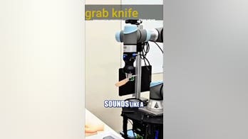 Robot stabs fake hand in AI security experiment