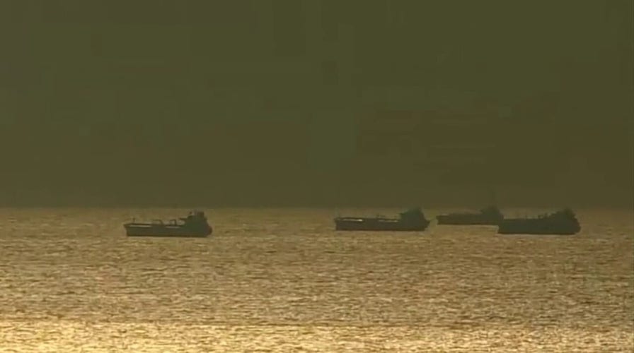 Container ships piling up offshore as US port strike threatens consumers, economy