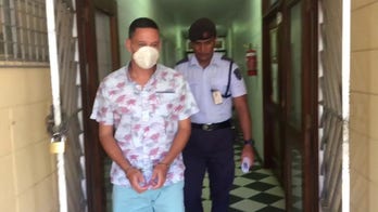 Bradley Dawson escorted to the cell block at the High Court in Lautoka, Fiji