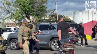 Anti-ICE agitator gets tossed outside Delaney Hall center