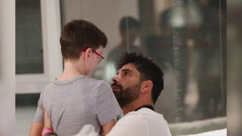 Ohad Munder, 9, is reunited with his father after his release from Gaza