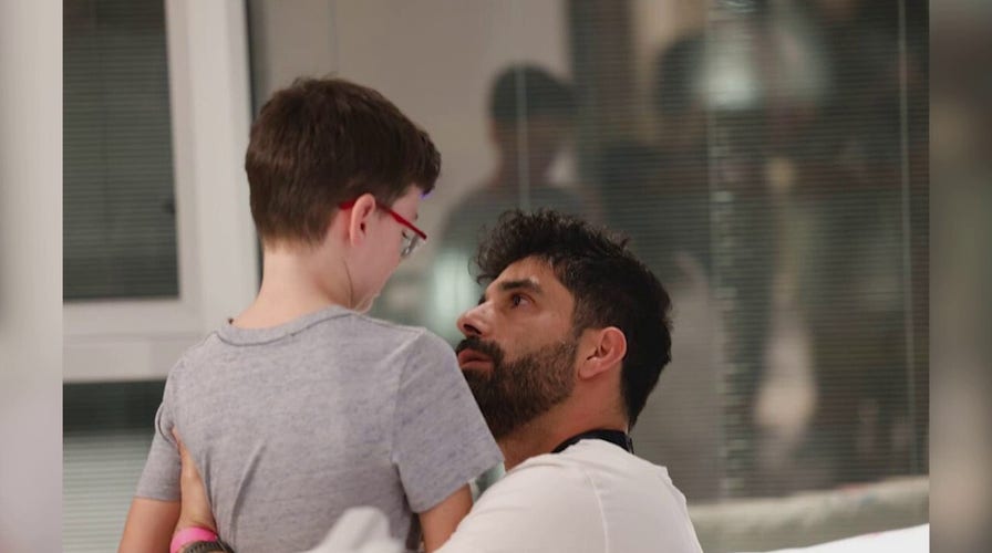 Ohad Munder, 9, is reunited with his father after his release from Gaza