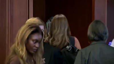 Woman accused of filming Lindsay Clancy jurors faces judge at arraignment