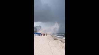 Stunning video reveals how beach storm grabbed vacationer's umbrella - Fox News