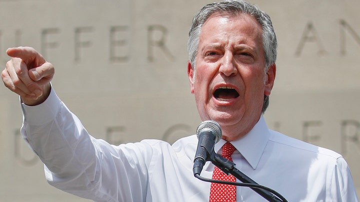 How will Mayor Bill de Blasio's threat to take funds away from the NYPD impact policing in New York?