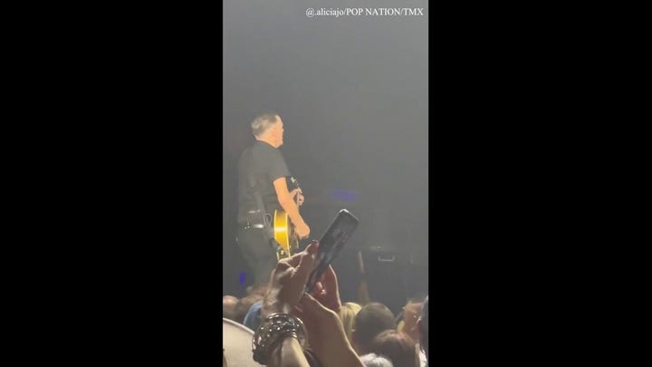 Bryan Adams interrupted by fan while performing 'Summer of '69'
