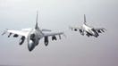 Air Force F-16 fighter jets refuel while flying over the Middle East