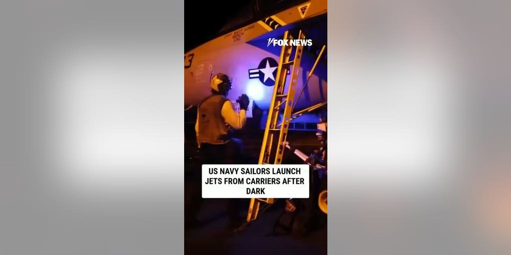 US Navy sailors launch jets from carriers after dark